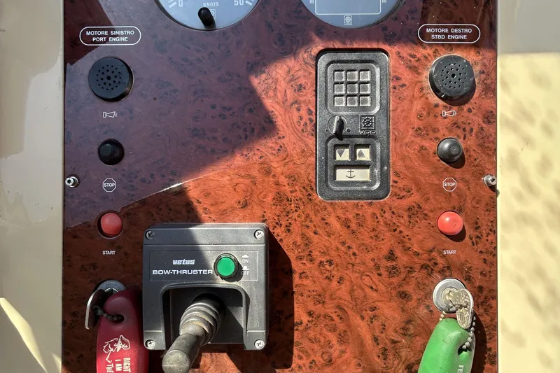  Yacht Photos Pics Control panel of a 1992 Ferretti Yachts 45 Altura with bow thruster and engine controls.