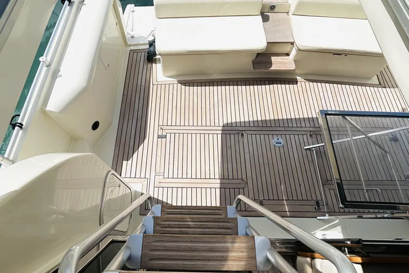  Yacht Photos Pics 1992 Ferretti Yachts 45 Altura deck with wooden flooring and seating area.