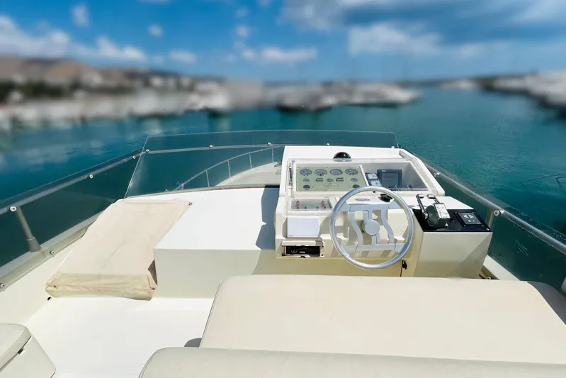  Yacht Photos Pics Helm of 1992 Ferretti Yachts 45 Altura overlooking serene blue waters.