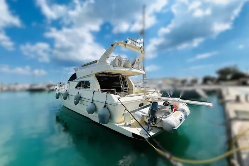  Yacht Photos Pics 1992 Ferretti Yachts 45 Altura docked in a sunny marina, clear blue sky.