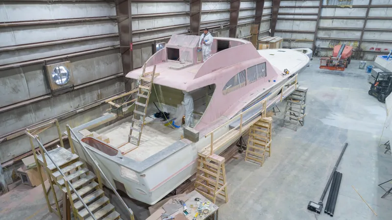 Chadwick 63 Yacht Photos Pics 2024 Custom Carolina 63 yacht under construction in a large indoor facility.