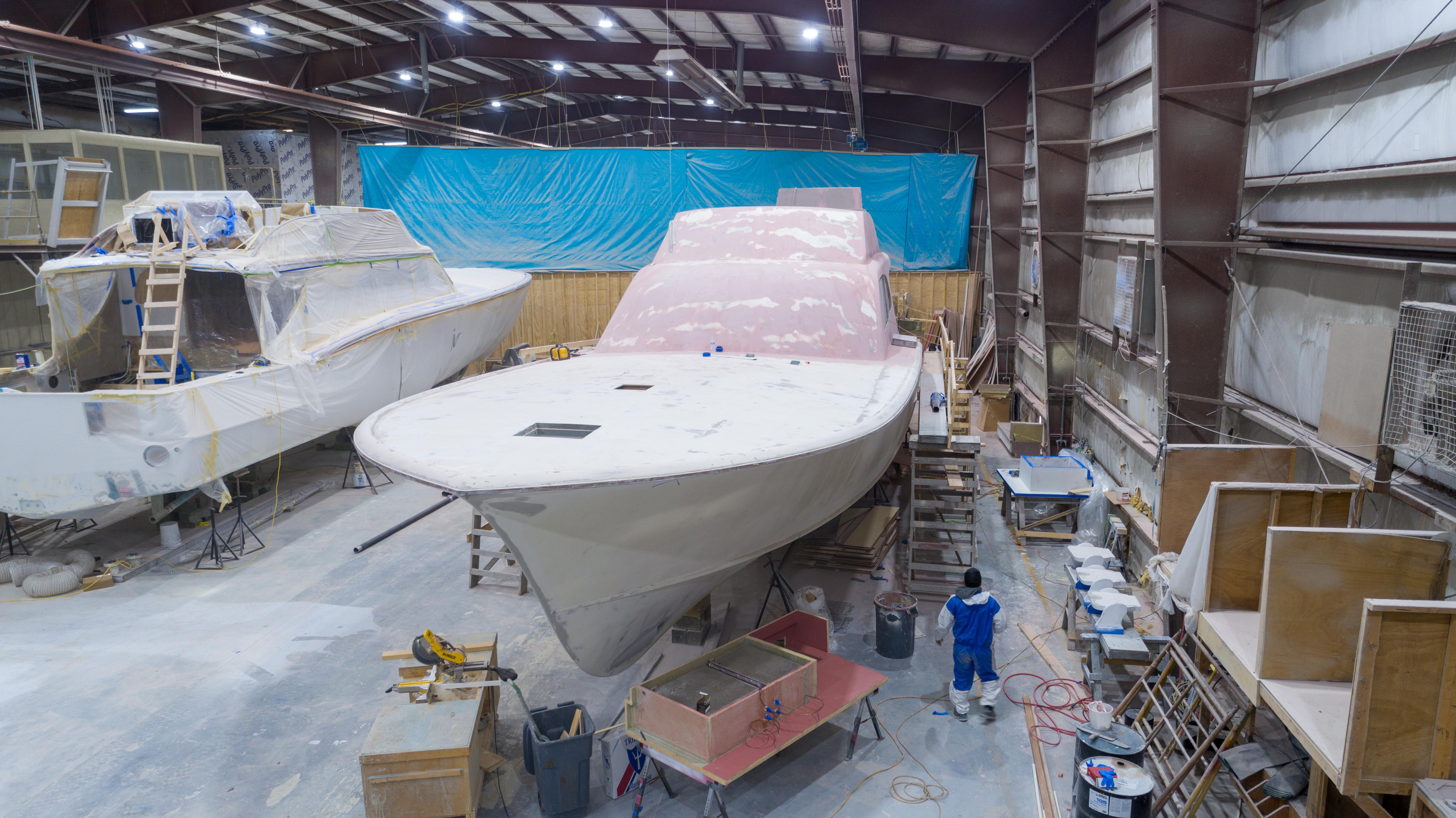 2024 Custom Carolina 63 yacht under construction in a workshop.