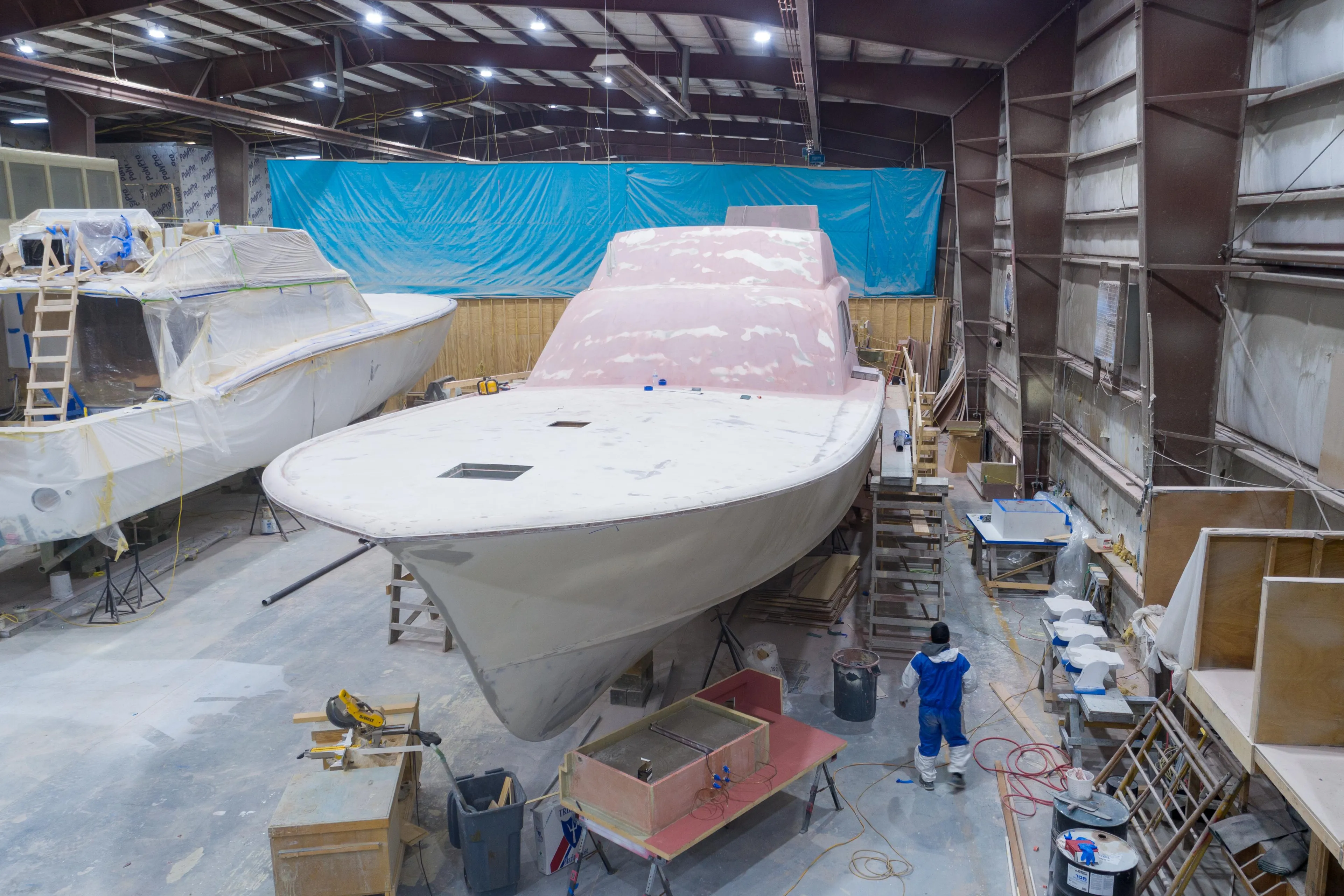 2024 Custom Carolina 63 yacht under construction in a workshop.