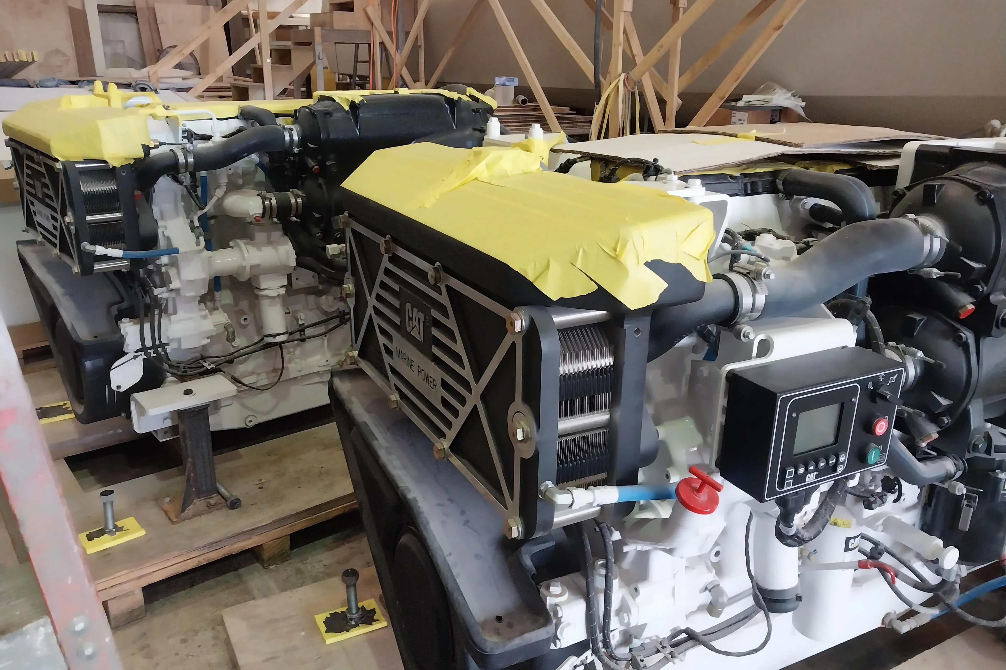 Custom Carolina 63 2024 boat engines in a workshop.