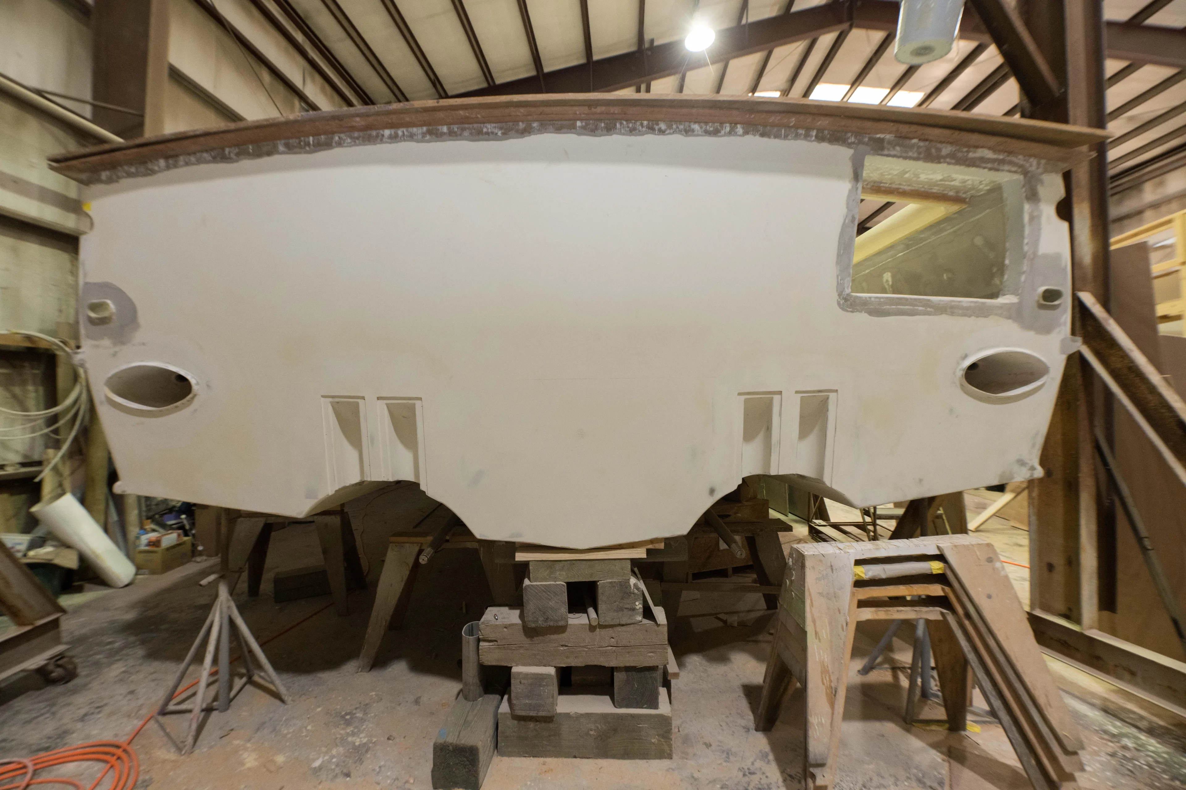 Custom Carolina 63 boat under construction in a workshop, 2024 model.