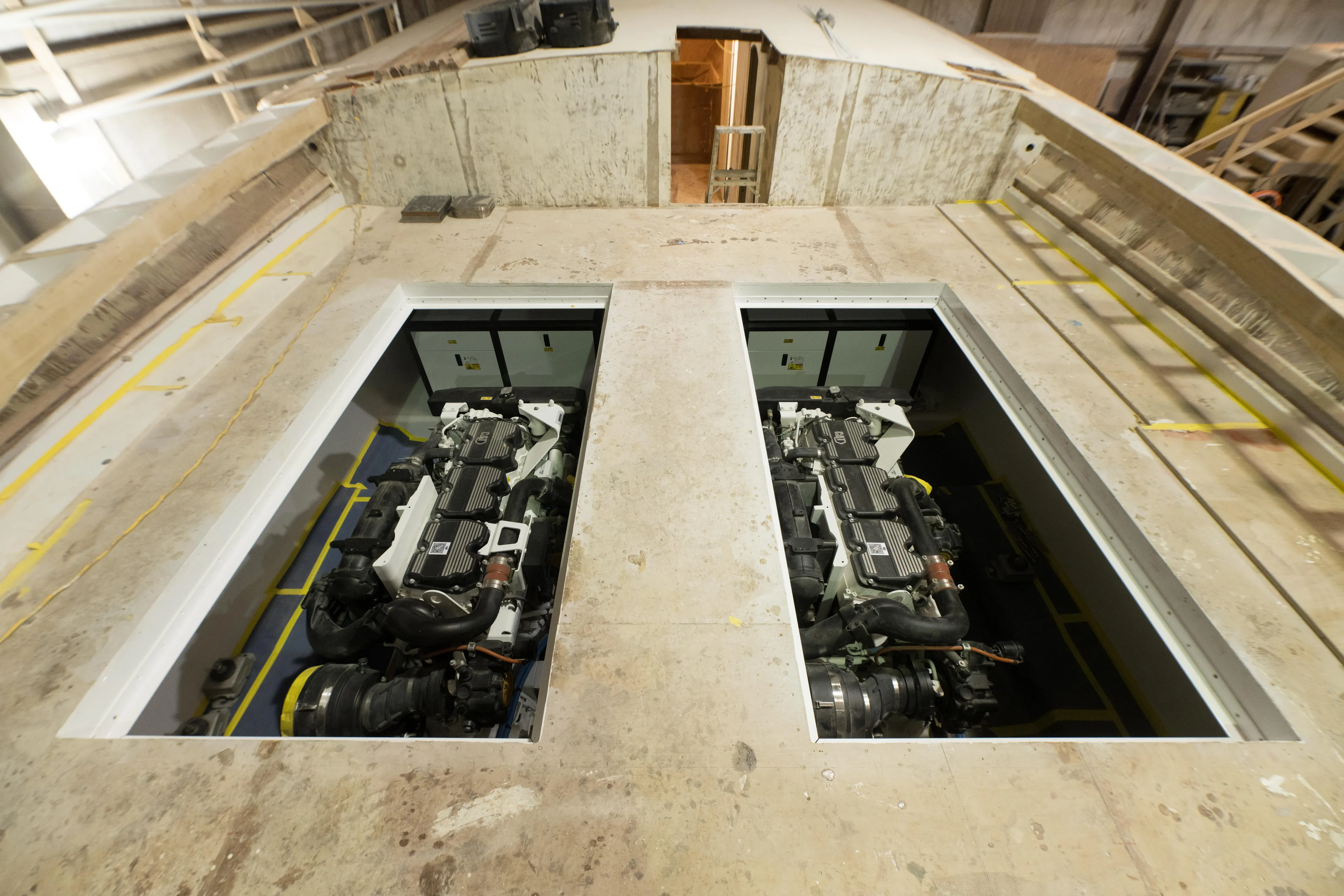 Chadwick 63 Yacht Photos Pics 2024 Custom Carolina 63 boat under construction, showcasing dual engine compartments.