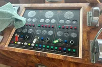Control panel of a 1970 Custom Bootswerft Burmester 24 boat with gauges and switches.