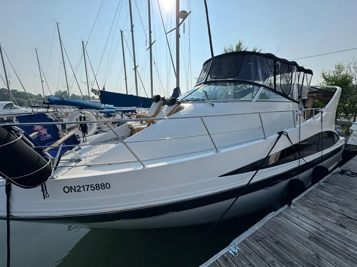  Yacht Photos Pics 2008 Carver 36 Mariner yacht docked at marina, surrounded by sailboats.