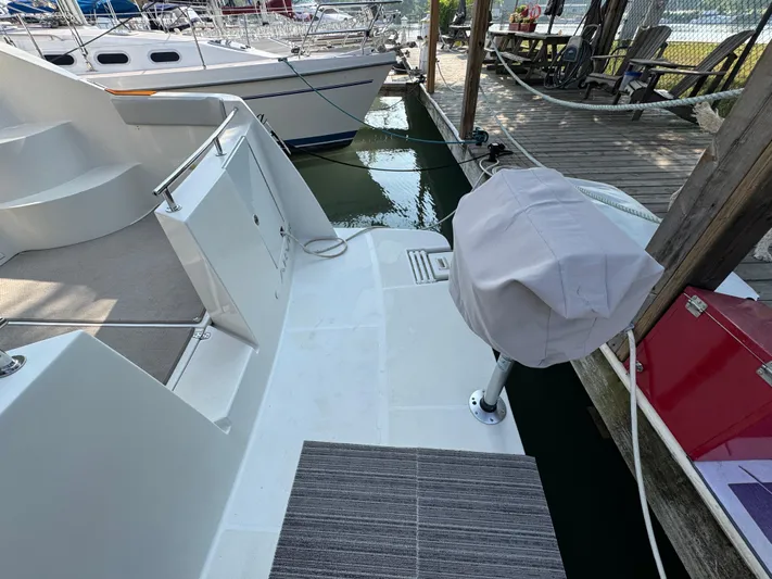  Yacht Photos Pics 2008 Carver 36 Mariner docked, showing deck and covered equipment.