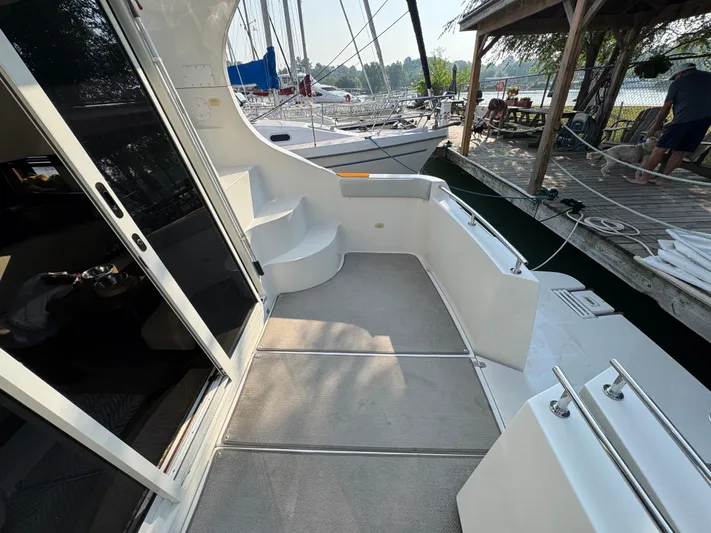  Yacht Photos Pics 2008 Carver 36 Mariner yacht deck with steps and dock view.