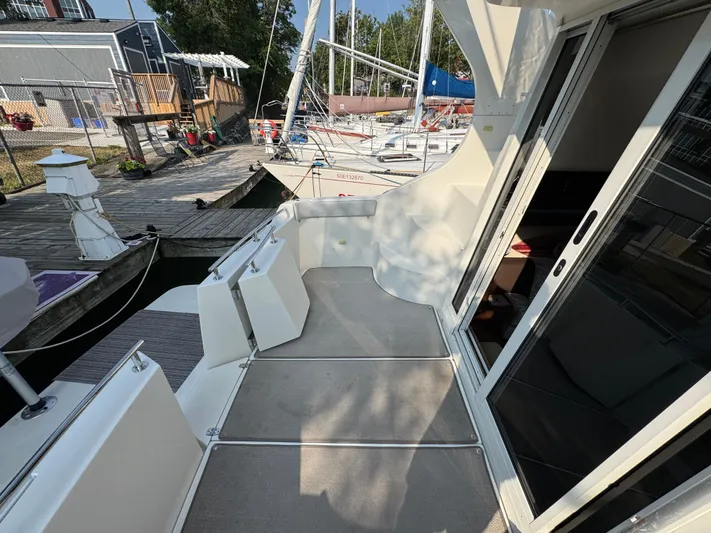  Yacht Photos Pics 2008 Carver 36 Mariner yacht docked, showing deck and sliding glass door.