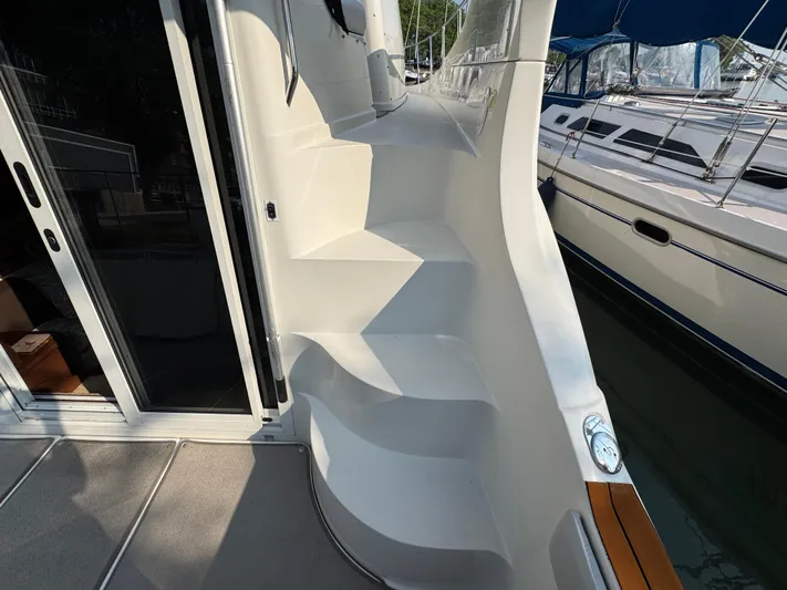  Yacht Photos Pics 2008 Carver 36 Mariner yacht with sleek white steps and modern design.