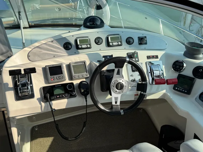  Yacht Photos Pics 2008 Carver 36 Mariner helm with steering wheel, navigation controls, and instrument panel.