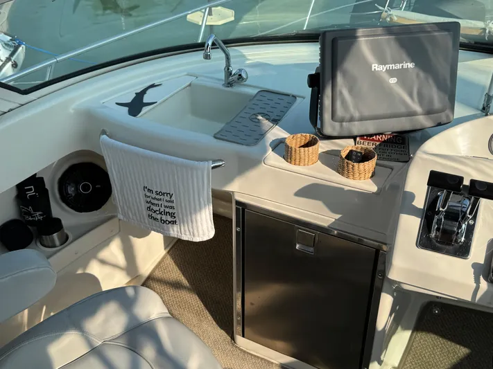  Yacht Photos Pics 2008 Carver 36 Mariner helm with Raymarine display and humorous towel.