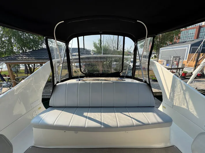  Yacht Photos Pics 2008 Carver 36 Mariner boat interior with cushioned seating and clear canopy.