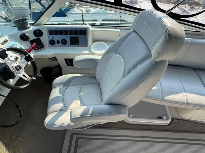  Yacht Photos Pics Captain's chair and helm of 2008 Carver 36 Mariner yacht, featuring modern controls and steering.