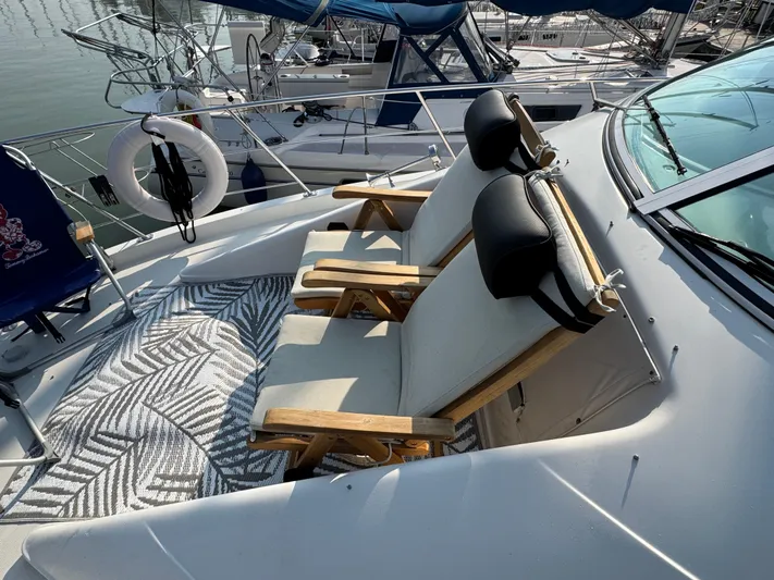  Yacht Photos Pics 2008 Carver 36 Mariner boat deck with cushioned chairs and patterned rug.