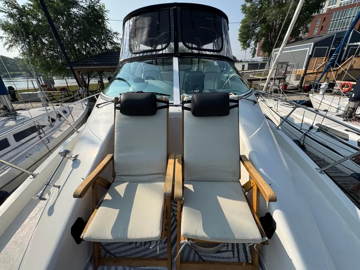  Yacht Photos Pics 2008 Carver 36 Mariner yacht with two deck chairs on the bow.