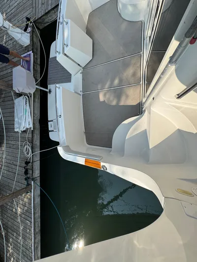  Yacht Photos Pics 2008 Carver 36 Mariner boat docked, showing deck and water reflection.