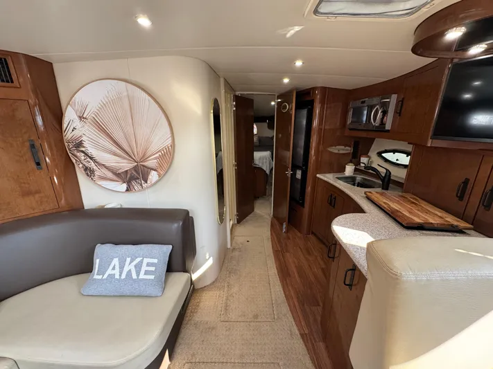  Yacht Photos Pics Interior of 2008 Carver 36 Mariner yacht with modern kitchen and cozy seating area.