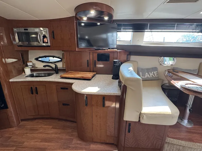  Yacht Photos Pics 2008 Carver 36 Mariner interior with kitchen, seating, and modern amenities.