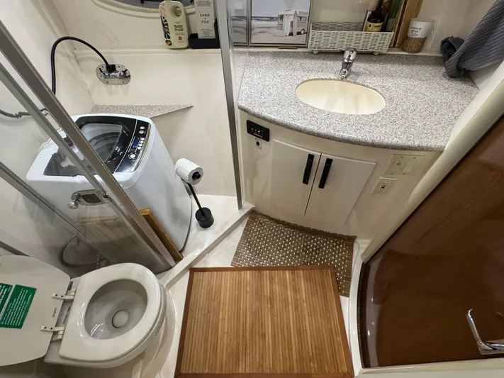  Yacht Photos Pics 2008 Carver 36 Mariner bathroom with washer, sink, and toilet in compact layout.