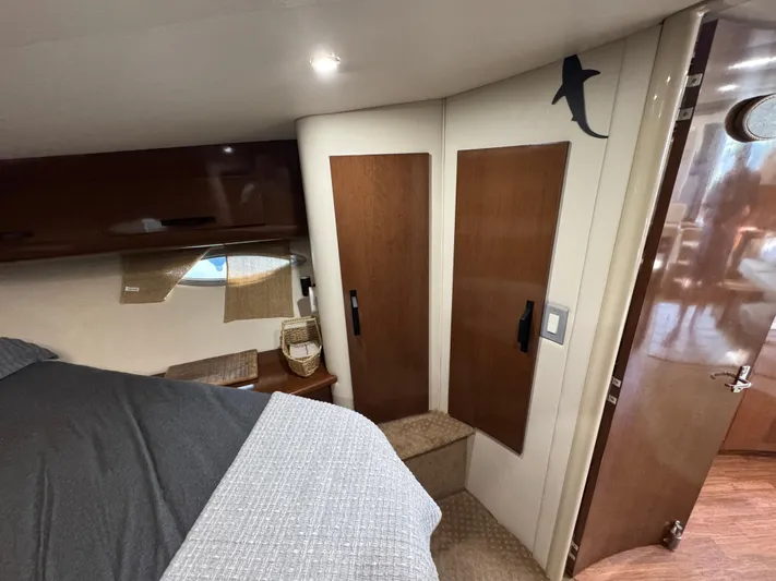  Yacht Photos Pics Interior of 2008 Carver 36 Mariner yacht cabin with wooden accents and cozy bedding.