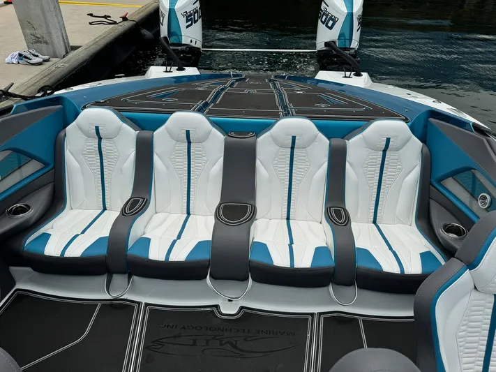  Yacht Photos Pics Luxury seating on 2024 MTI 440X boat with stylish blue and white design.