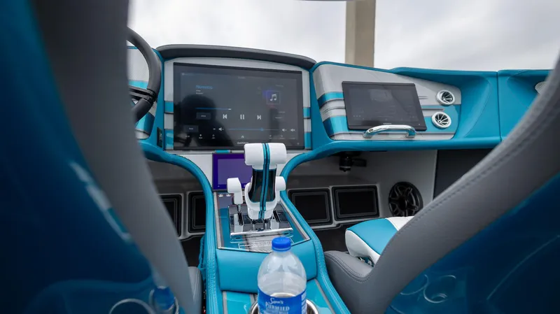  Yacht Photos Pics Interior of 2024 MTI 440X boat with modern dashboard and blue accents.