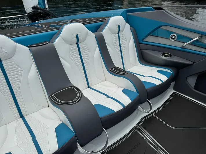  Yacht Photos Pics 2024 MTI 440X boat interior with blue and white seating, modern design.