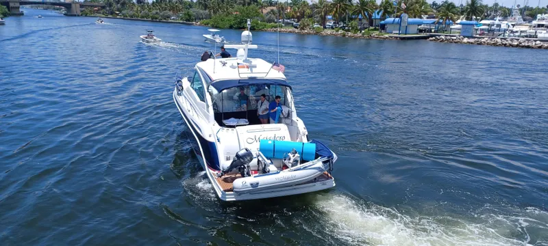 Majadero Yacht Photos Pics 2008 Formula 45 Yacht cruising on a scenic waterway with passengers onboard.