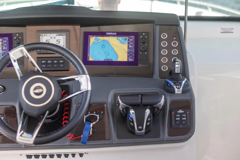  Yacht Photos Pics Dashboard of 2022 Chaparral 300 OSX boat with navigation screens and controls.
