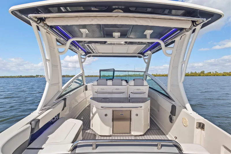  Yacht Photos Pics 2022 Chaparral 300 OSX boat interior with seating, open water view.