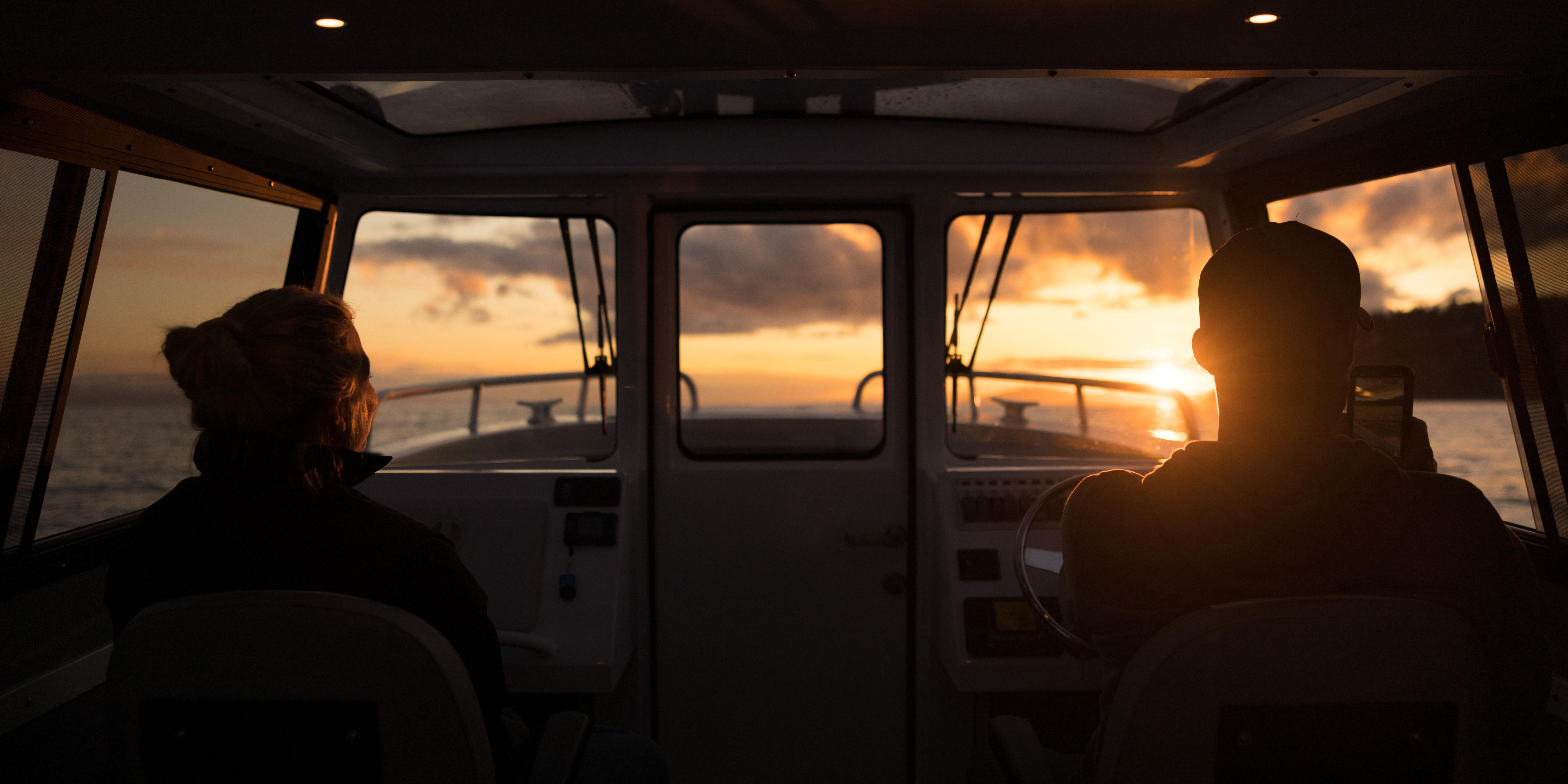 Interior view of 2025 Jasper Marine Defender 22 boat at sunset.