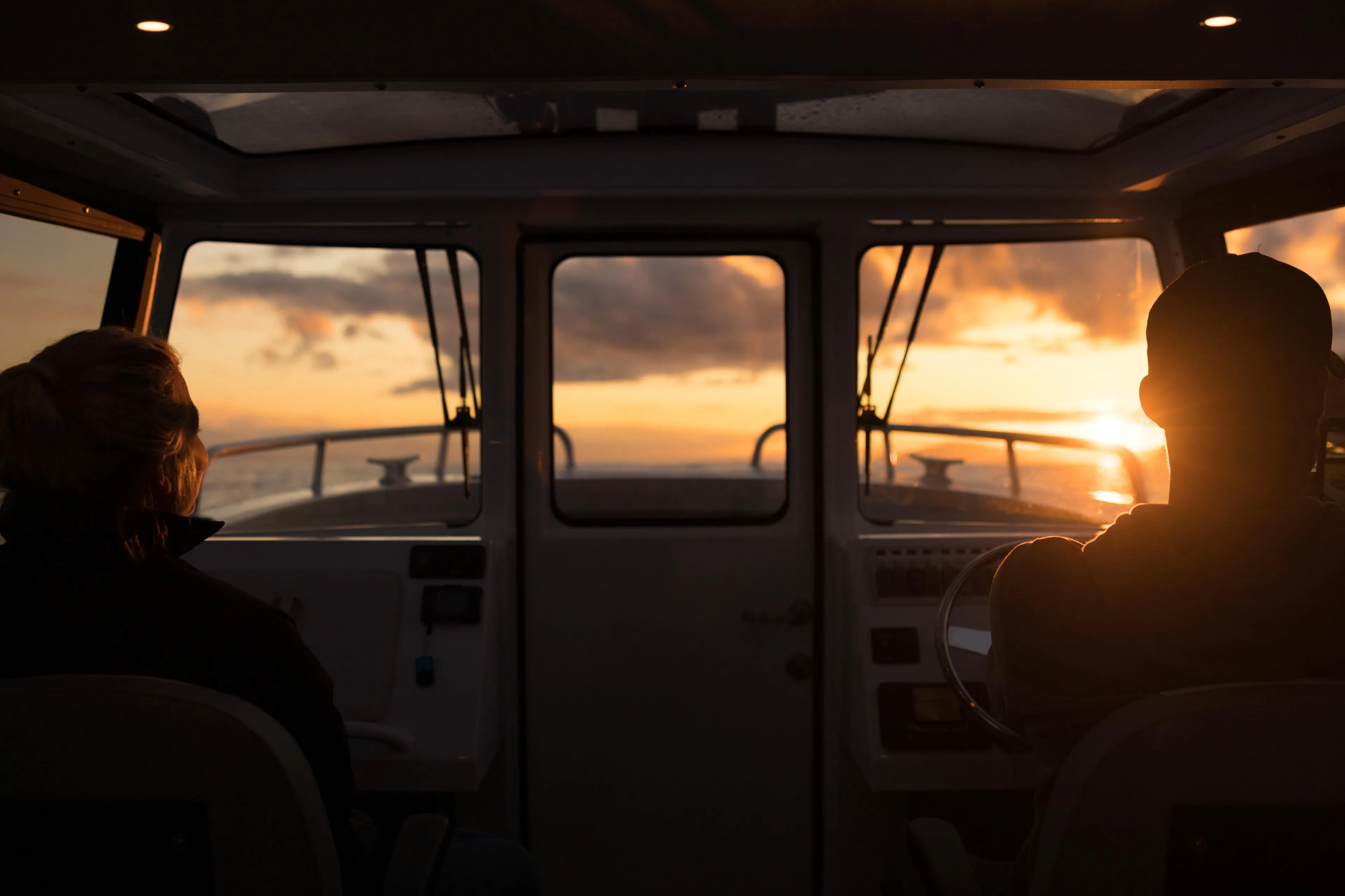 Interior view of 2025 Jasper Marine Defender 22 boat at sunset.