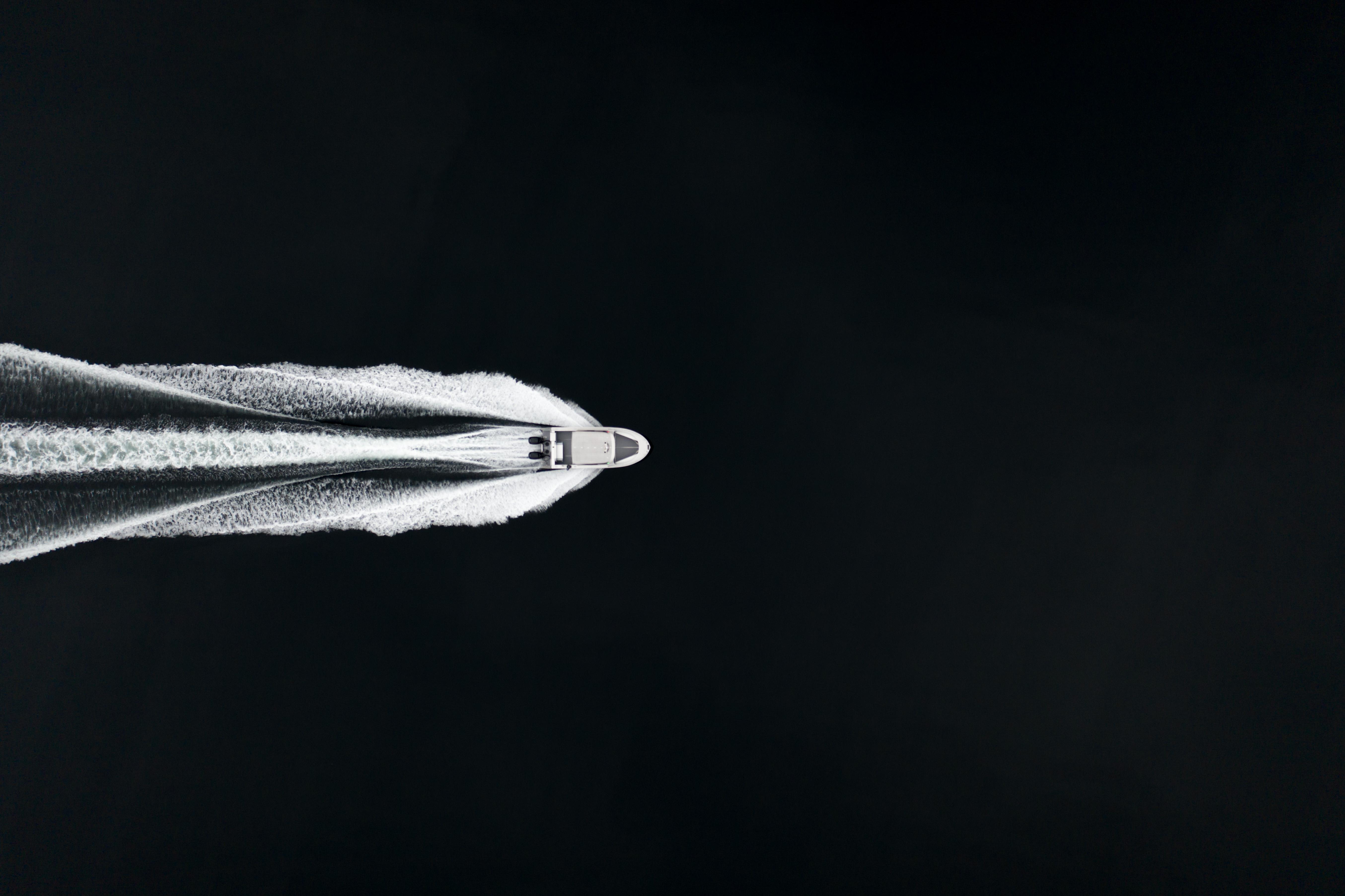 Aerial view of 2025 Jasper Marine Defender 22 speedboat cutting through water.