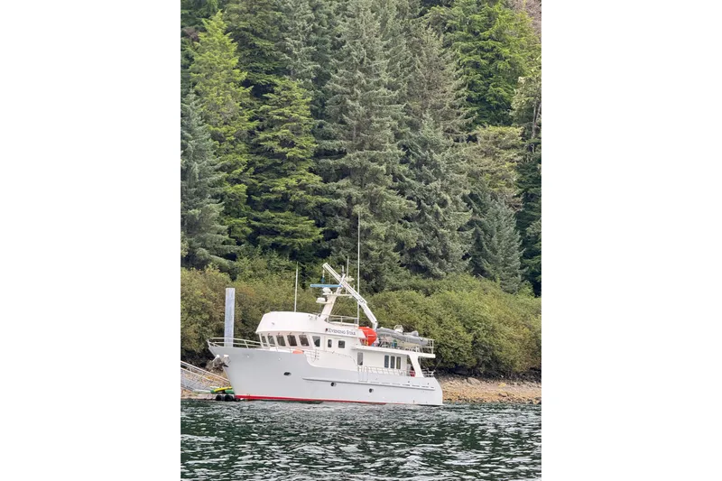 Evening Star Yacht Photos Pics Cape Horn 2003 Trawler docked by lush forest shoreline.