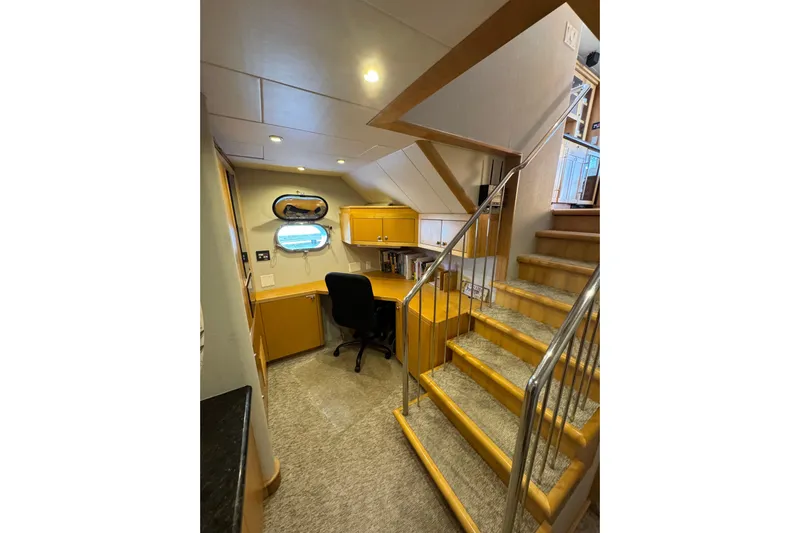 Evening Star Yacht Photos Pics Interior of 2003 Cape Horn Trawler with desk, chair, and staircase.