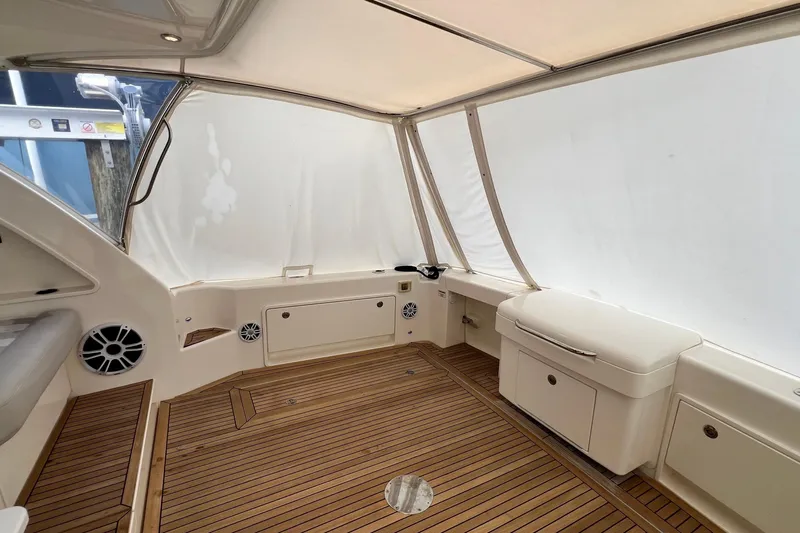  Yacht Photos Pics 2017 Riviera 445 SUV interior with teak flooring and white seating.