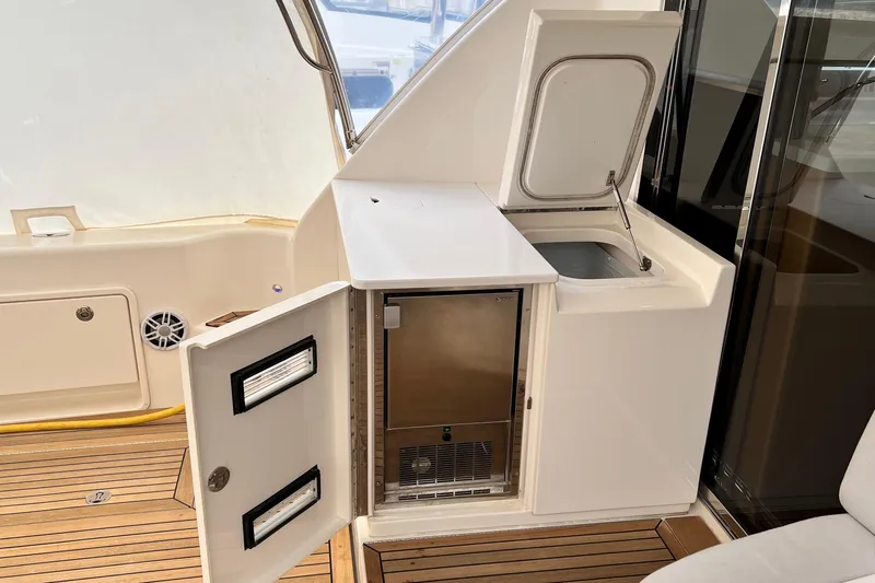  Yacht Photos Pics 2017 Riviera 445 SUV yacht interior with kitchenette and storage.