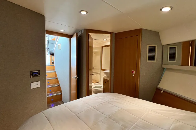  Yacht Photos Pics Interior of 2017 Riviera 445 SUV yacht, featuring bedroom and bathroom with modern design.