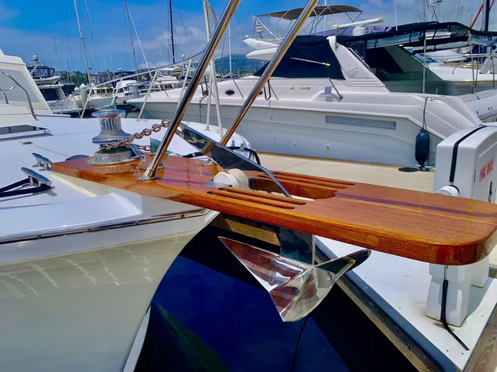  Yacht Photos Pics 1984 Egg Harbor 48 Flybridge Cruiser with polished anchor and wooden deck detail.