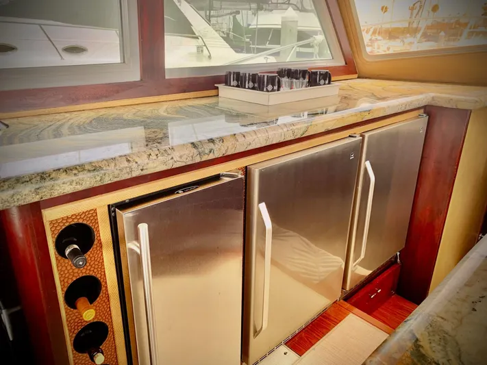  Yacht Photos Pics 1984 Egg Harbor 48 Flybridge Cruiser interior with stainless steel appliances and granite countertop.