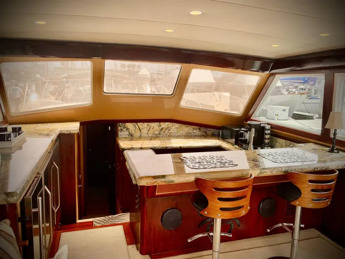  Yacht Photos Pics Luxurious interior of a 1984 Egg Harbor 48 Flybridge Cruiser with elegant wood and granite finishes.