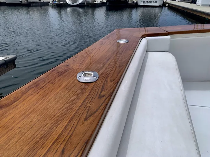  Yacht Photos Pics 1984 Egg Harbor 48 Flybridge Cruiser with polished wood railing at marina.