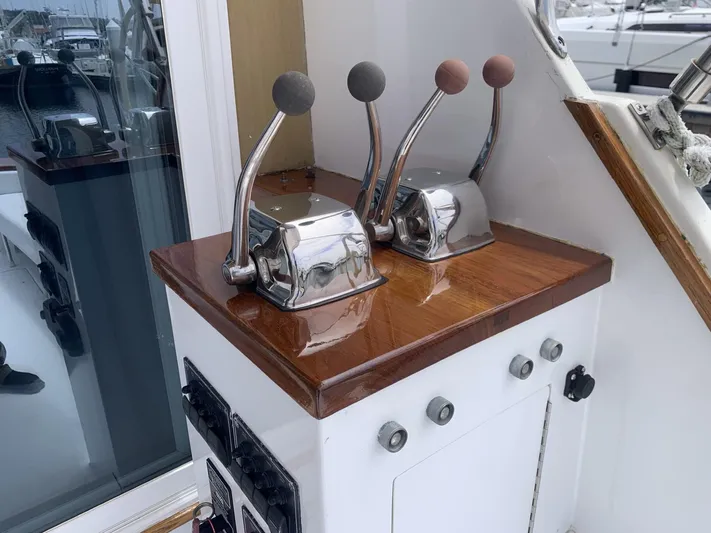  Yacht Photos Pics Control panel of 1984 Egg Harbor 48 Flybridge Cruiser with dual throttle levers.