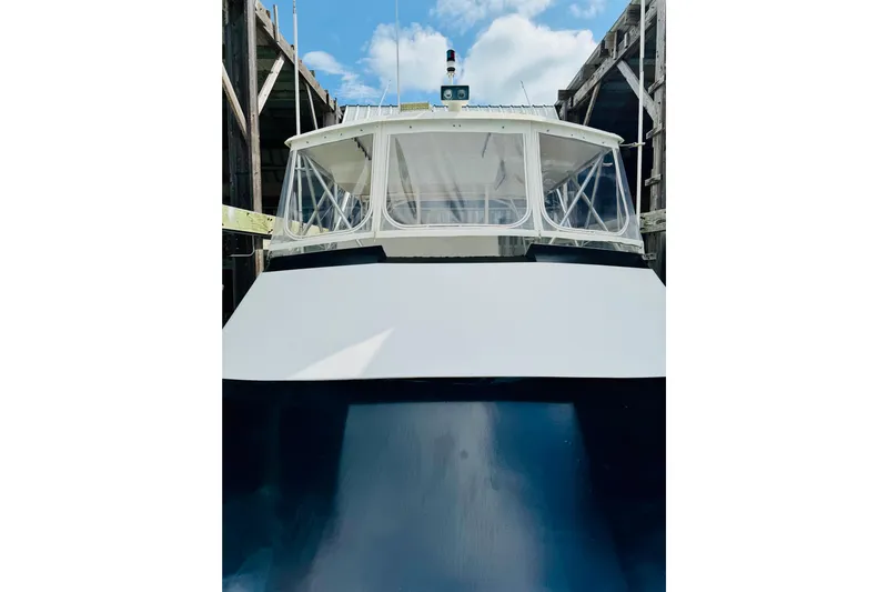 All In Yacht Photos Pics 1993 Viking 50 Convertible boat docked, showcasing its sleek design and sturdy build.