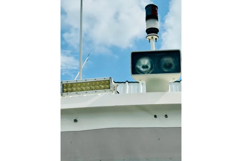All In Yacht Photos Pics Radar and light equipment on 1993 Viking 50 Convertible boat under blue sky.