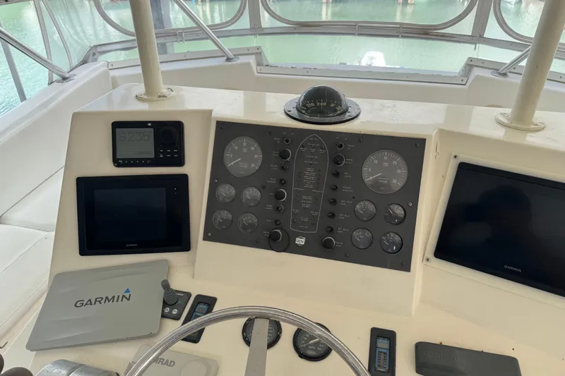 All In Yacht Photos Pics Control panel of a 1993 Viking 50 Convertible boat with Garmin navigation equipment.