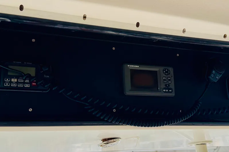 All In Yacht Photos Pics Control panel of a 1993 Viking 50 Convertible boat with communication devices.